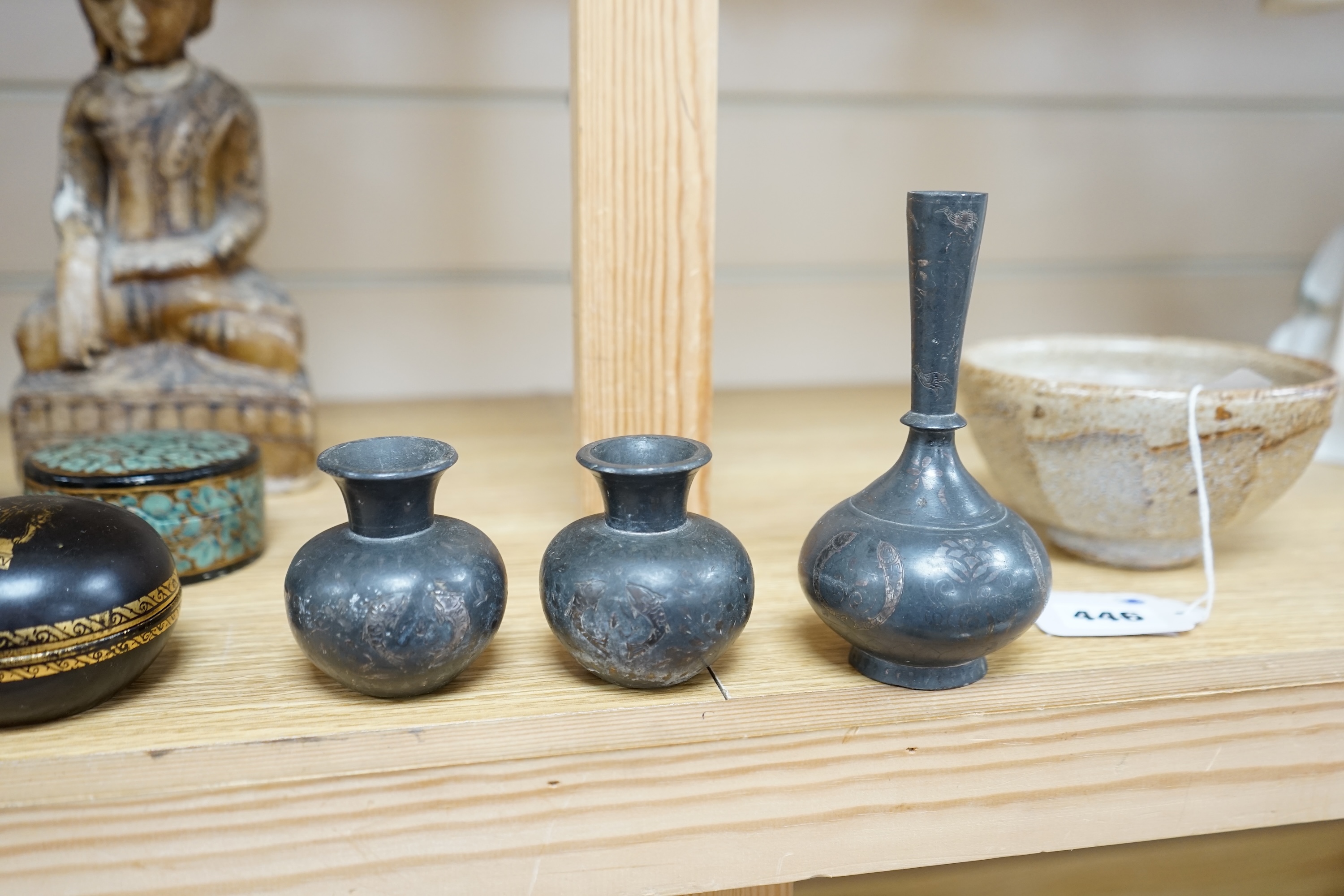 A collection of South East Asian and Indian collectables to include Bidri ware, alabaster Buddha and four papier mache pots, largest 26cm high. Condition - mostly fair